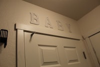 a white door with the word baby on it